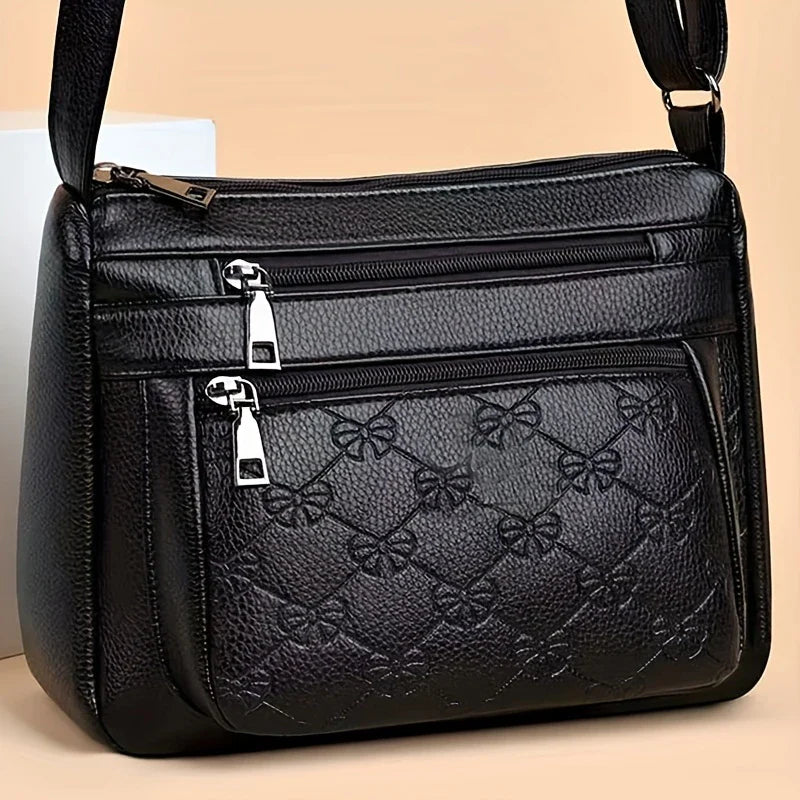 URBAN EDGE™ — BLACK CROSSBODY BAG WITH EMBOSSED GEOMETRIC PATTERN